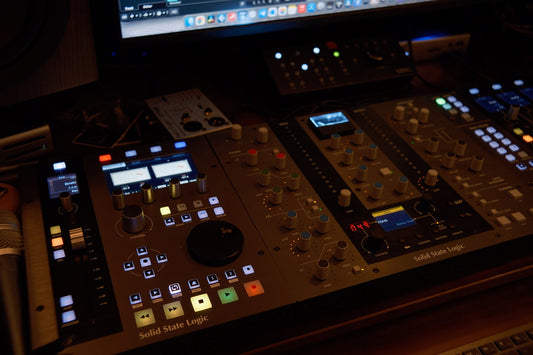 Control panel with various buttons and displays on a dark background